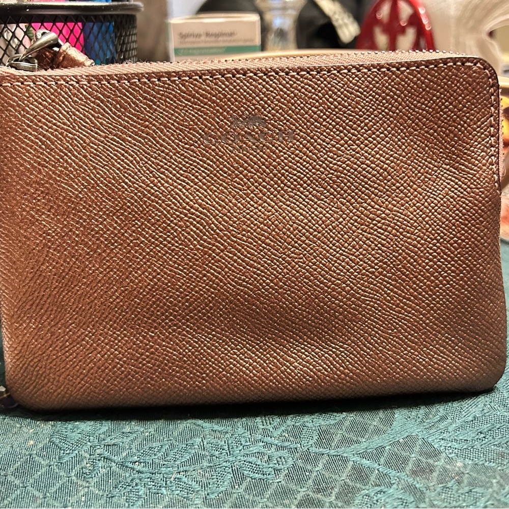 Rose gold coach wristlet